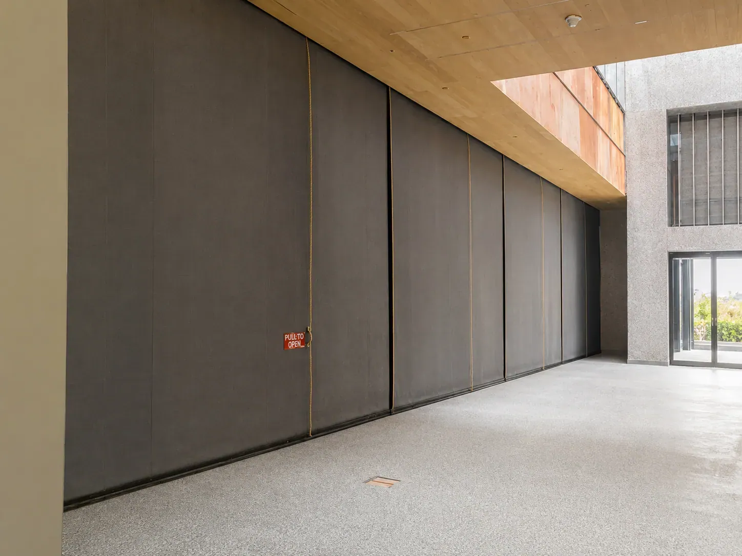 Steel-Tex Hose Stream 120 fire shutter with first-responder swing door, deployed