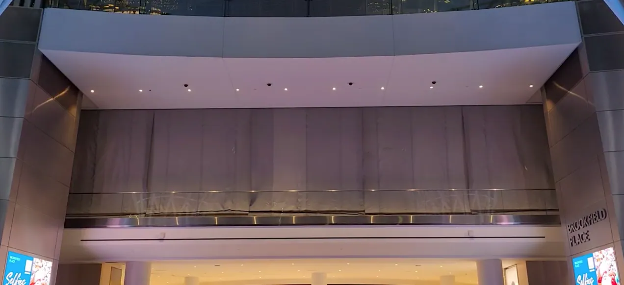 Deployed SD60 smoke curtain sealing an atrium opening